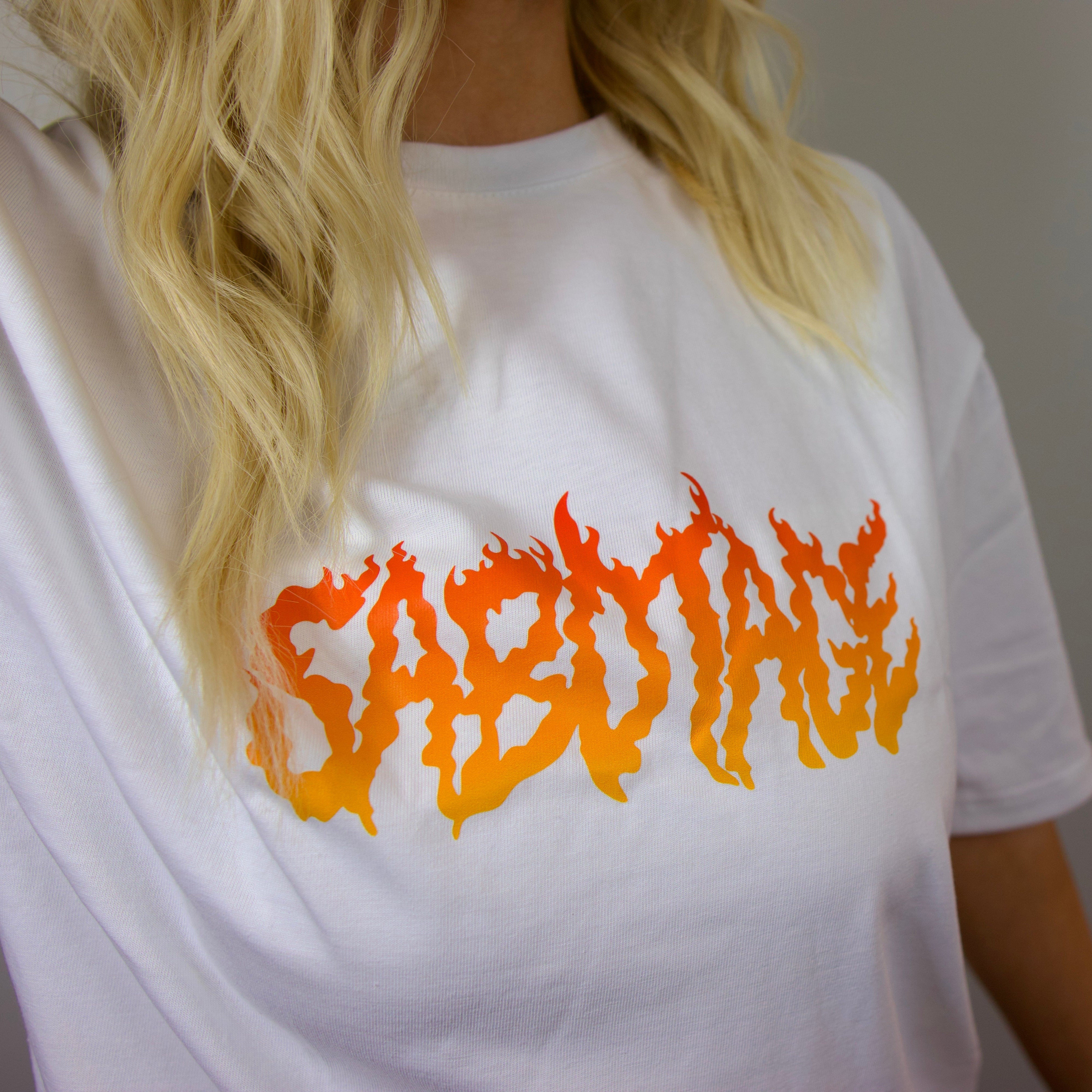 Premium streetwear model in luxury fire t-shirt detail fire logo shot
