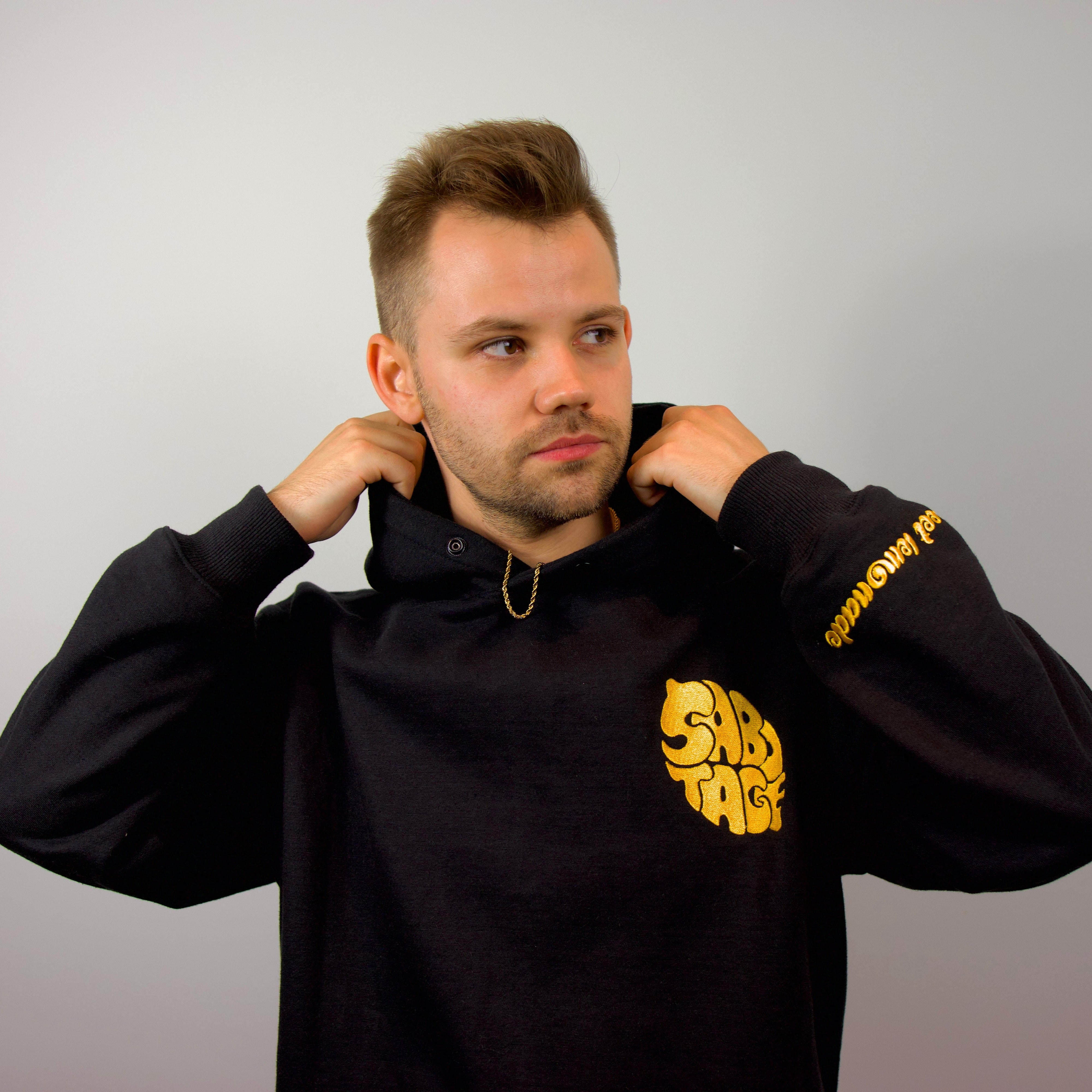 Man wearing luxury Lemon Hoodie front premium streetwear logo detail made in Portugal